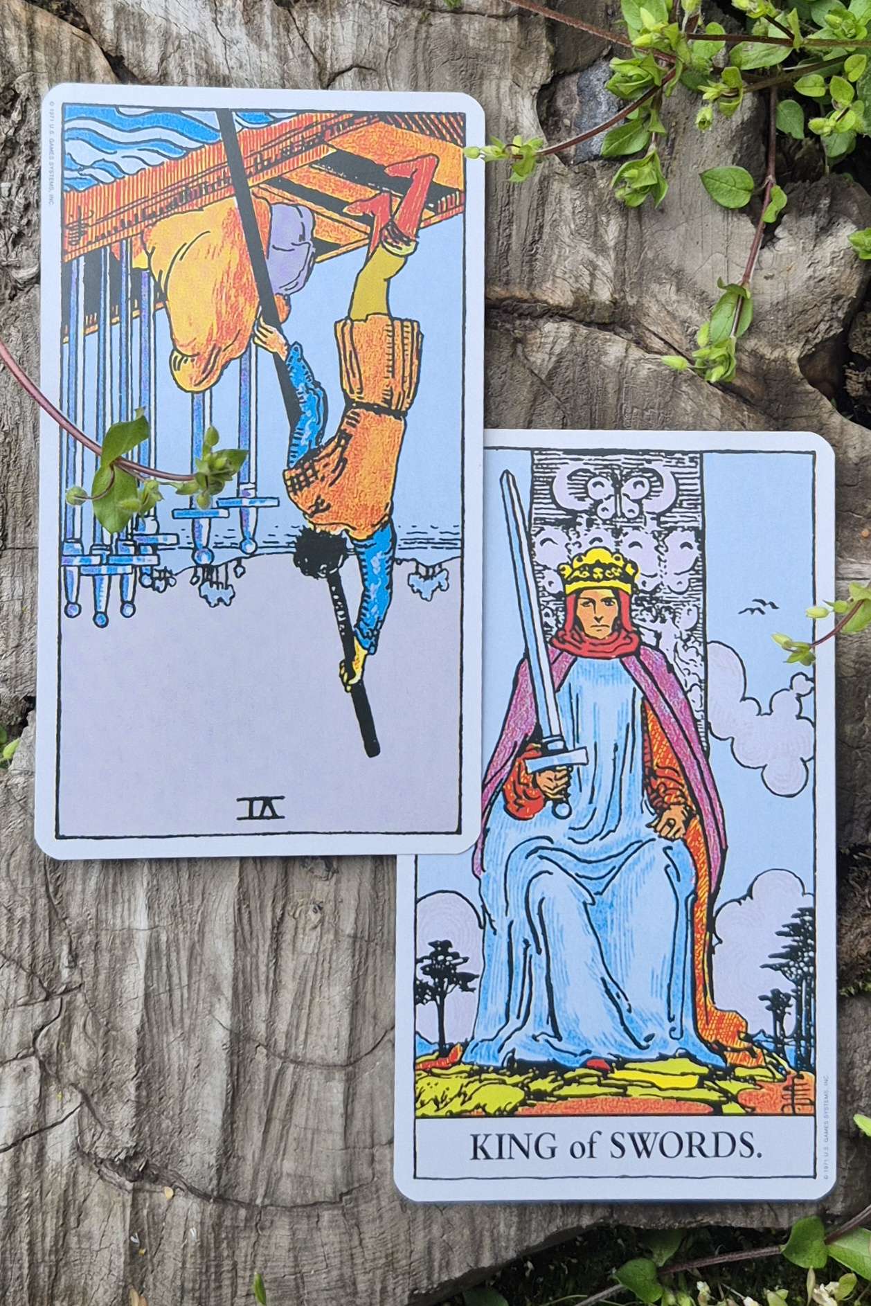 Aquarius tarot cards - Six of Swords Reversed and King of Swords