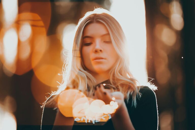 You Already Have Everything You Need. This Pendant Just Helps You Trust It. Young woman holding fairy lights dreamy bokeh spiritual glow