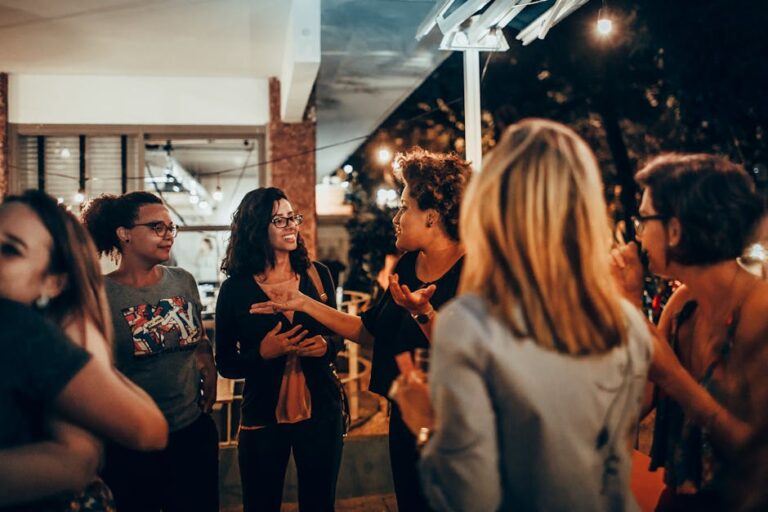 Authenticity Is Social Infrastructure People gathered in warm light having an honest conversation.